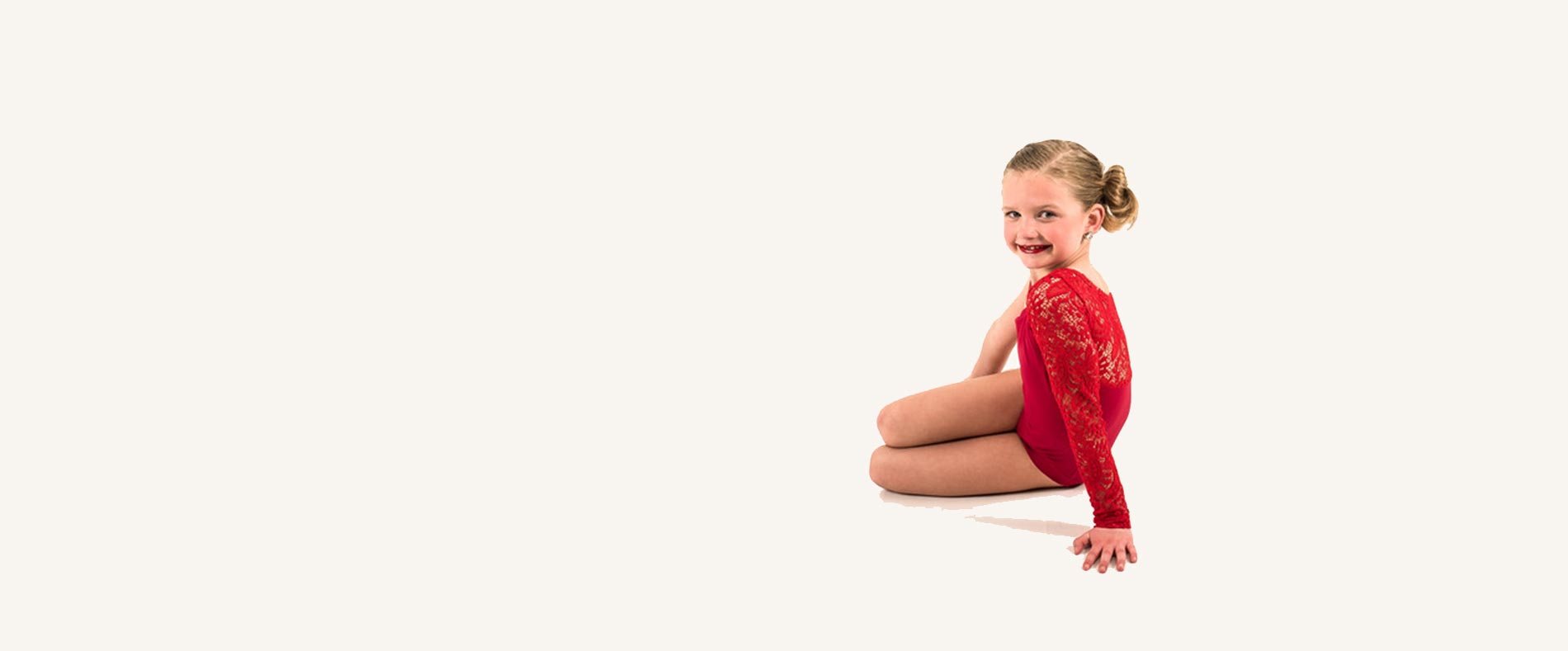 A young Tueller dancer in a red leotard