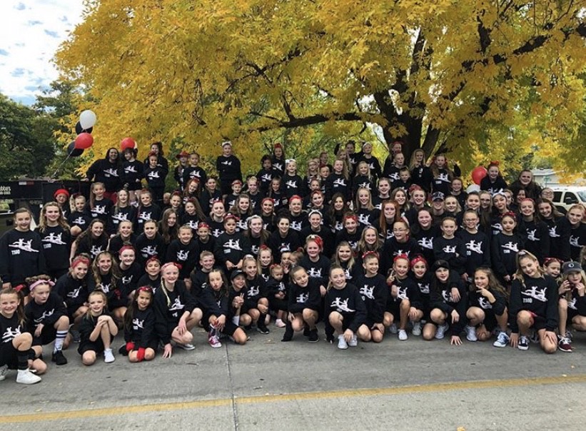 The whole TSOD family in team sweatshirts at the parade